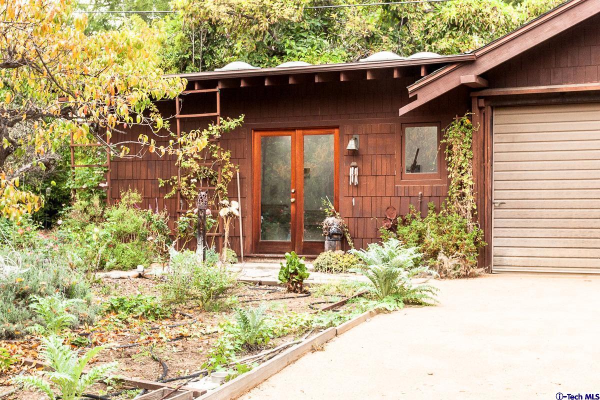 1255 Morada Place Altadena, CA 91001 - Photo 36 of 37 a front view of a house with a yard