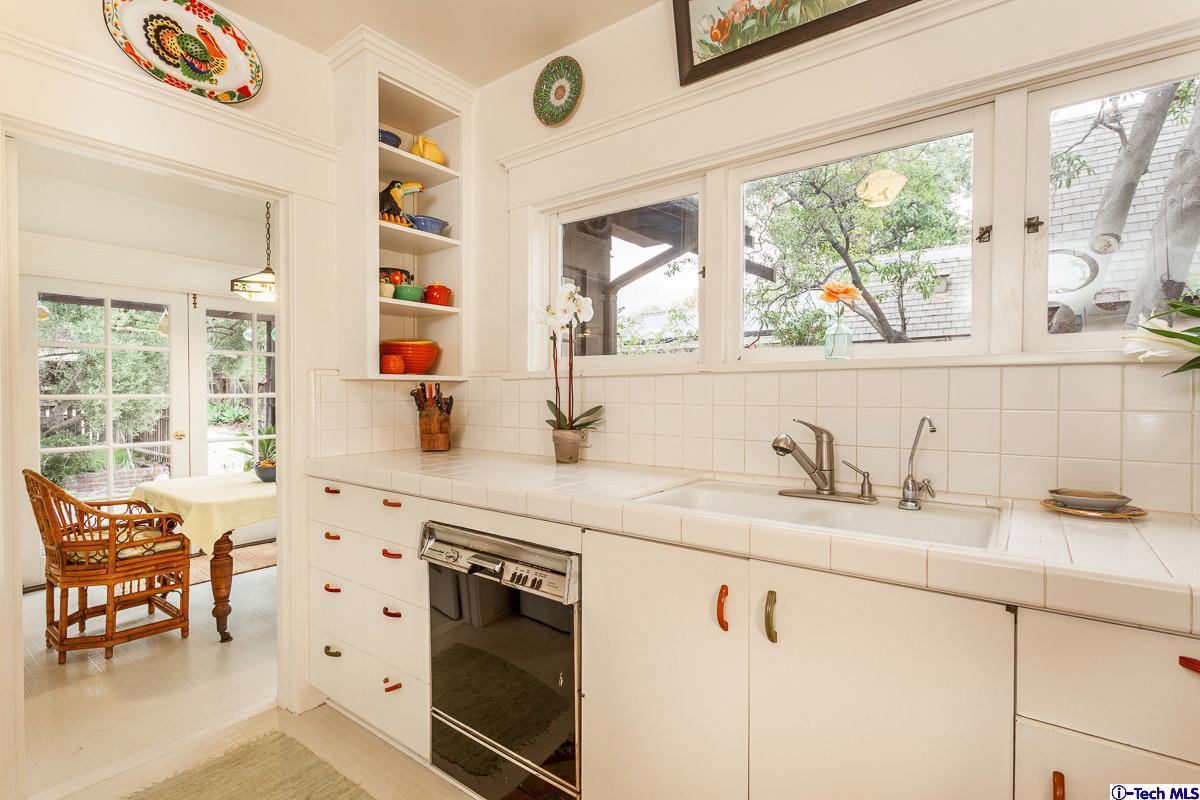 1255 Morada Place Altadena, CA 91001 - Photo 10 of 37 a kitchen with a sink stove and cabinets