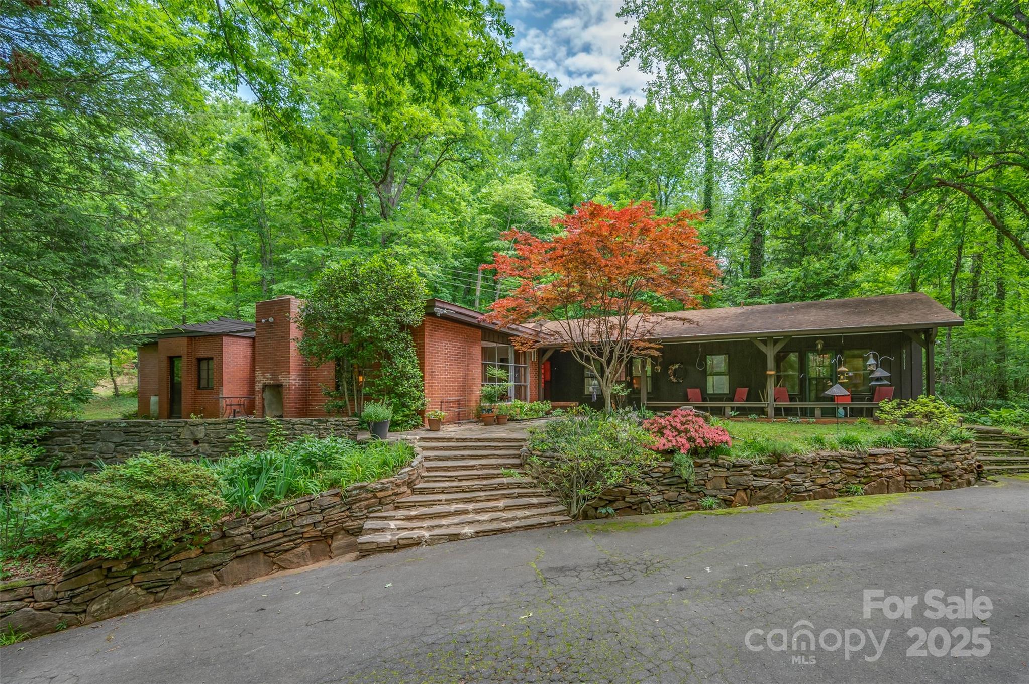 312 Page Farm Road Tryon, NC 28782 - Photo 1 of 44 a front view of a house with garden