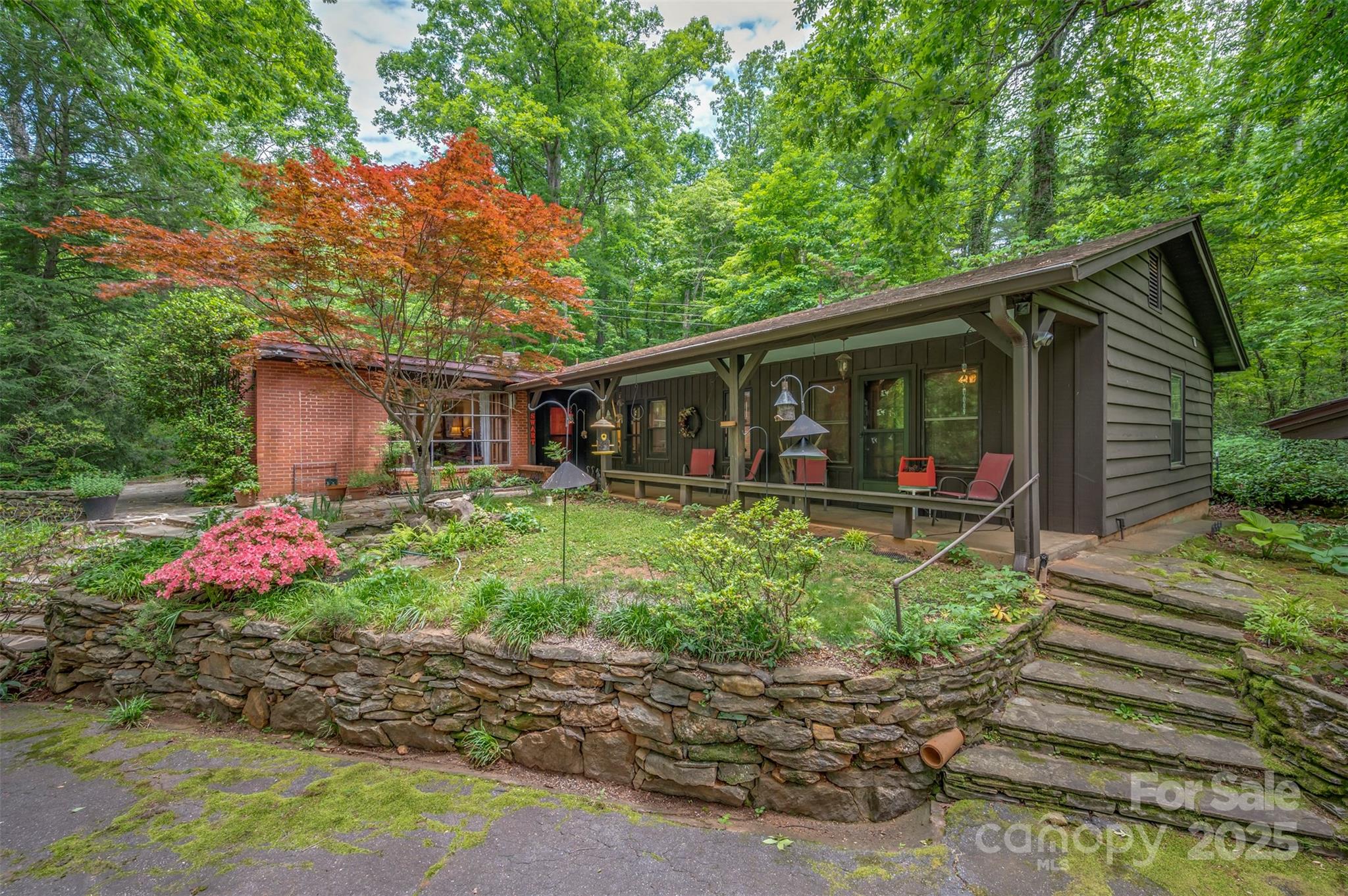 312 Page Farm Road Tryon, NC 28782 - Photo 3 of 44 a front view of house with a garden