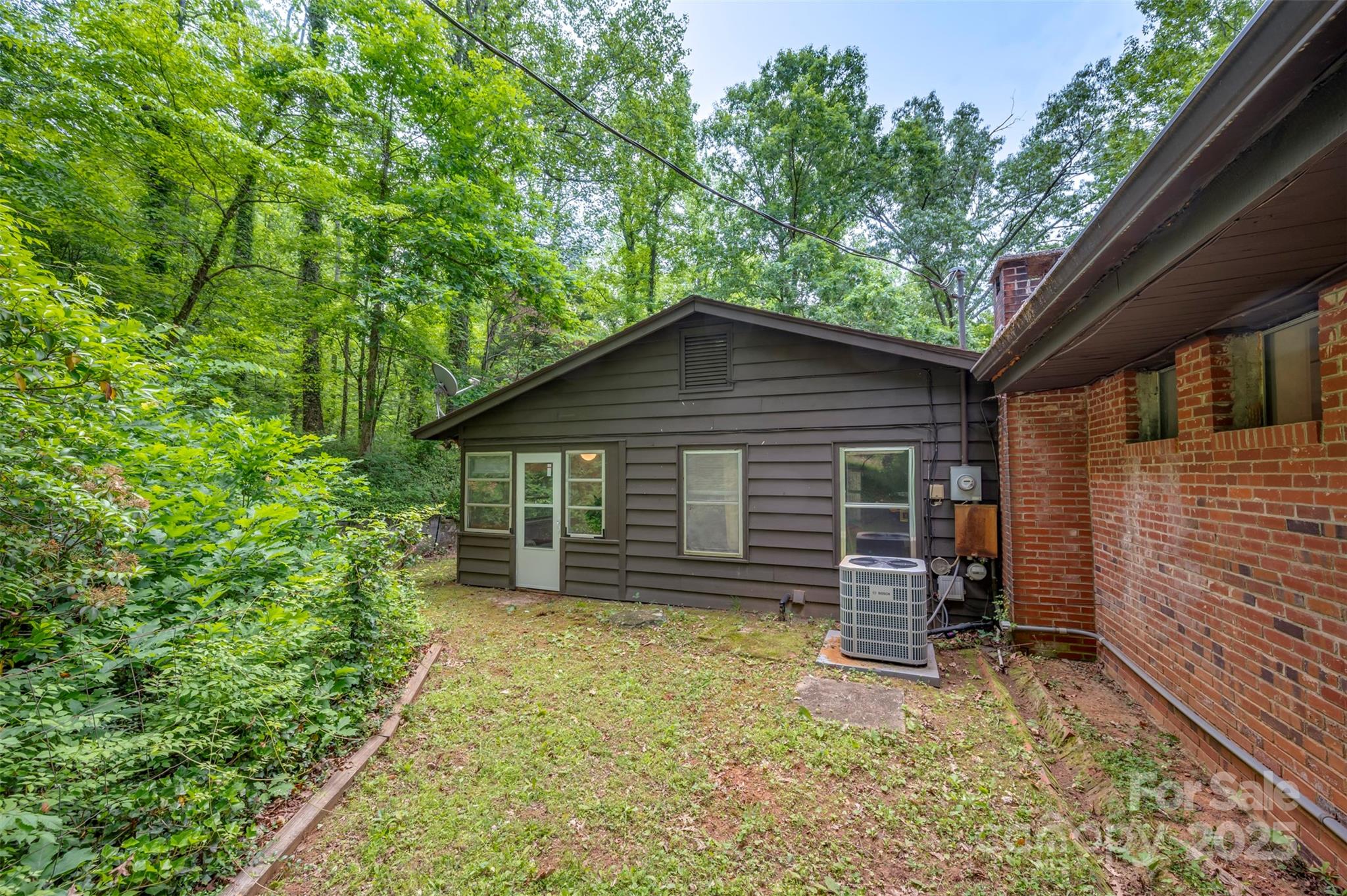312 Page Farm Road Tryon, NC 28782 - Photo 36 of 44 a view of a house with a yard and wooden fence