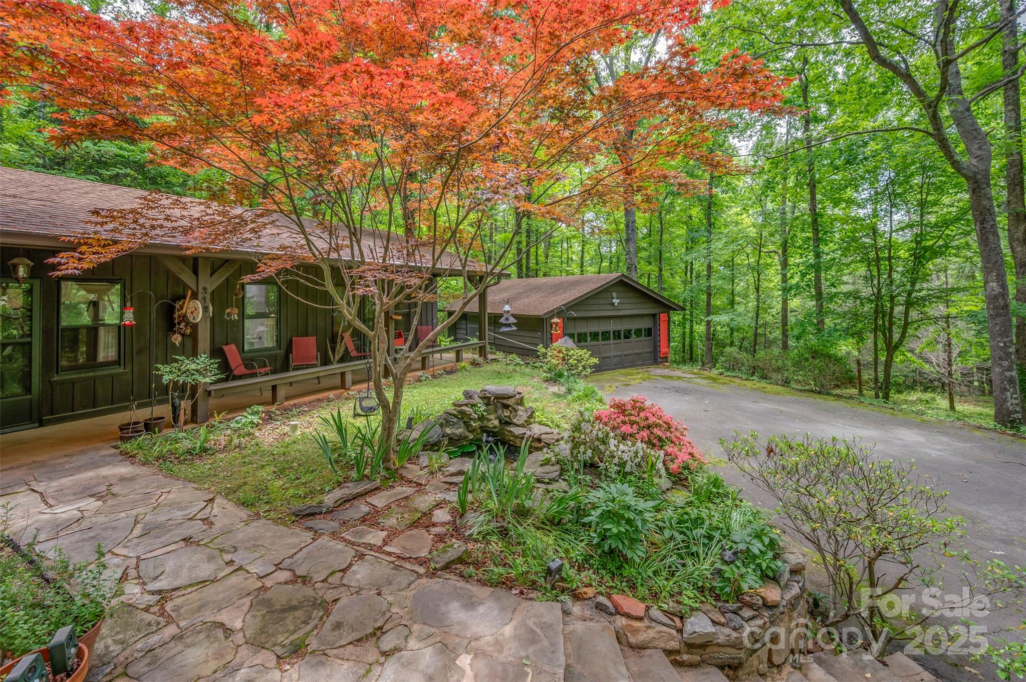 312 Page Farm Road Tryon, NC 28782 - Photo 7 of 44 a front view of a house with garden