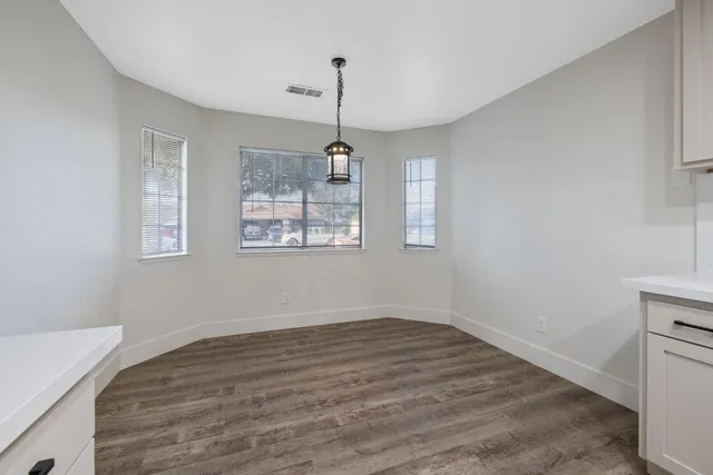 a room with window and wooden floor