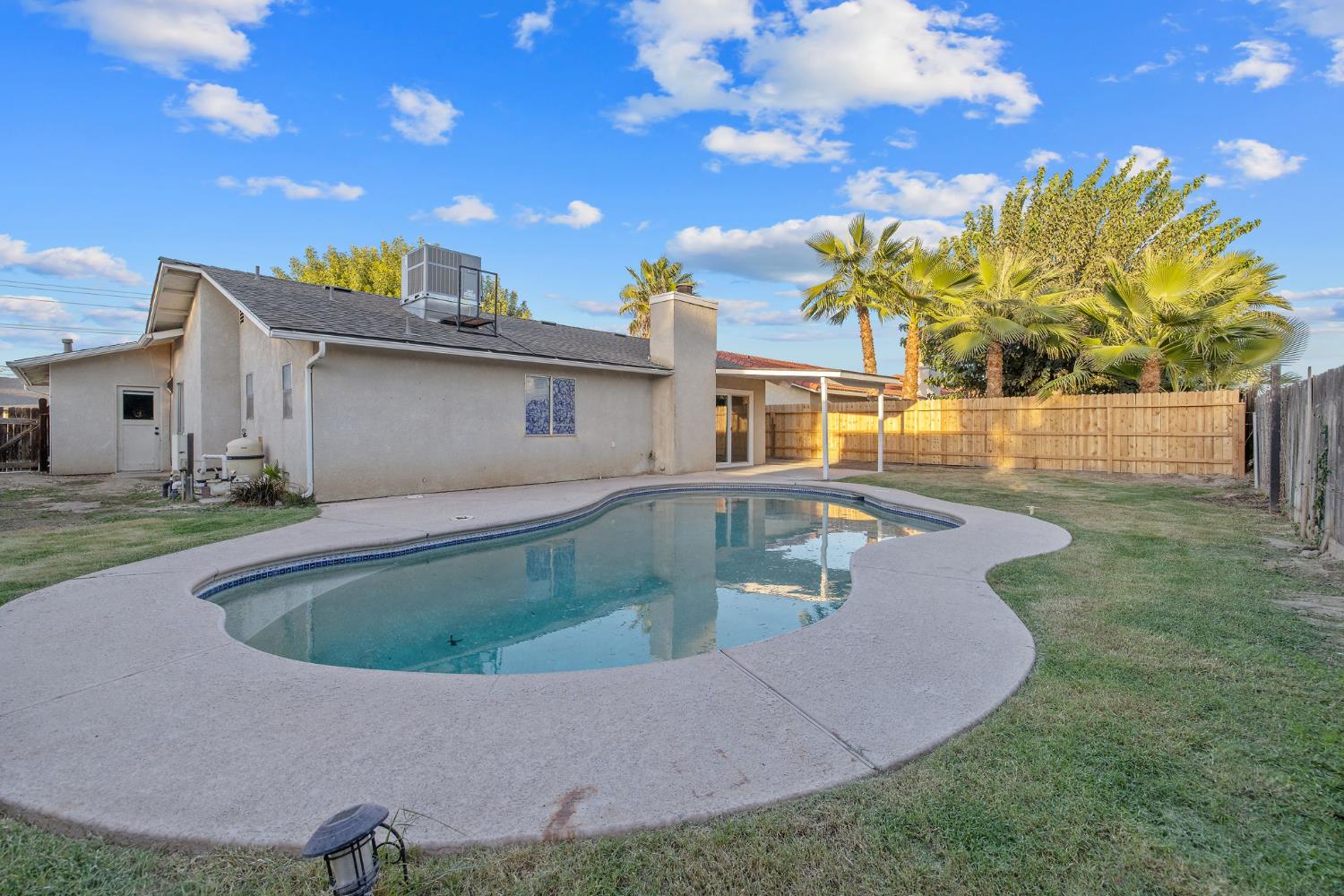 1249 Levich Street Hanford, CA 93230 - Photo 2 of 43 a view of outdoor space yard and swimming pool
