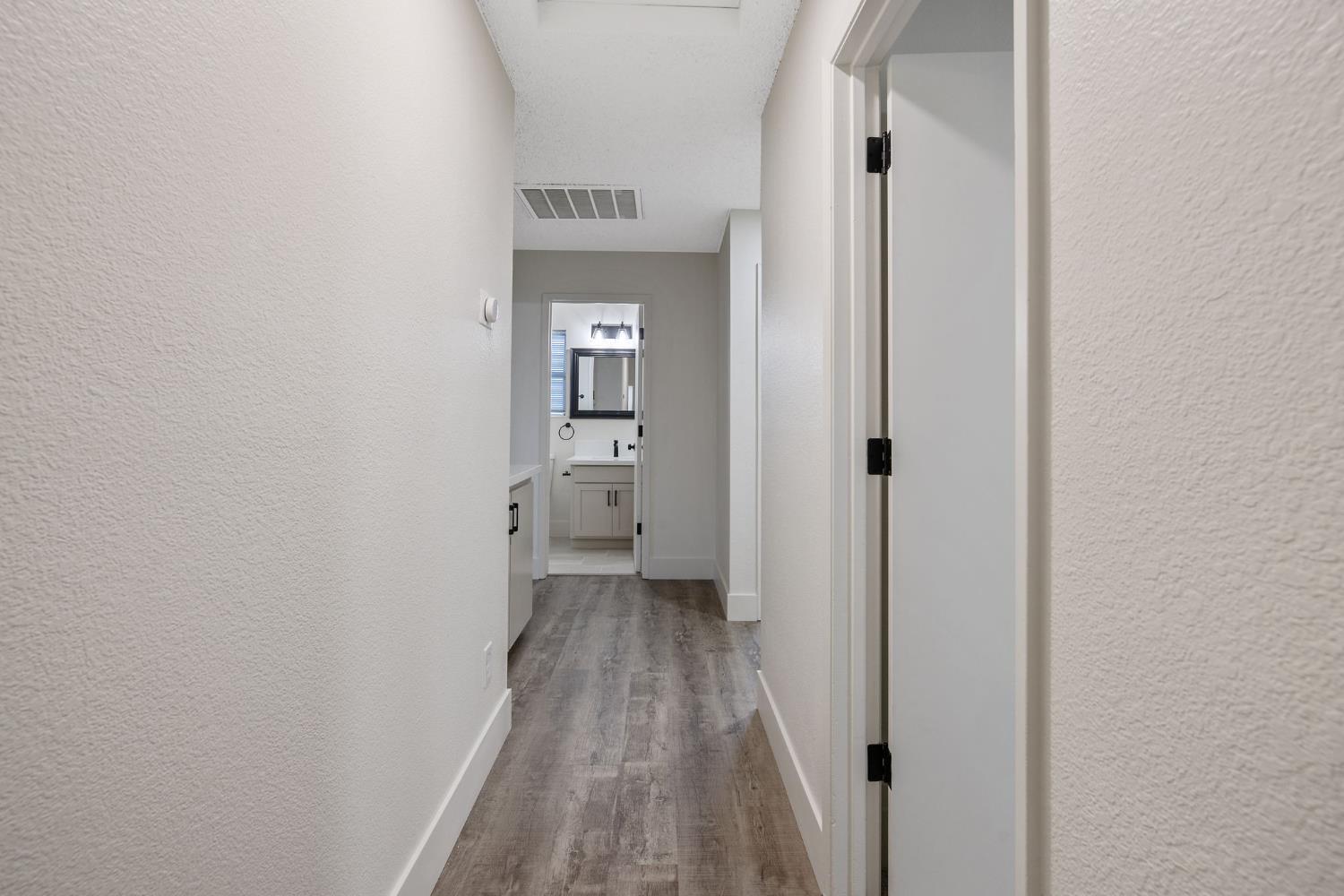1249 Levich Street Hanford, CA 93230 - Photo 21 of 43 a view of a room with wooden floor