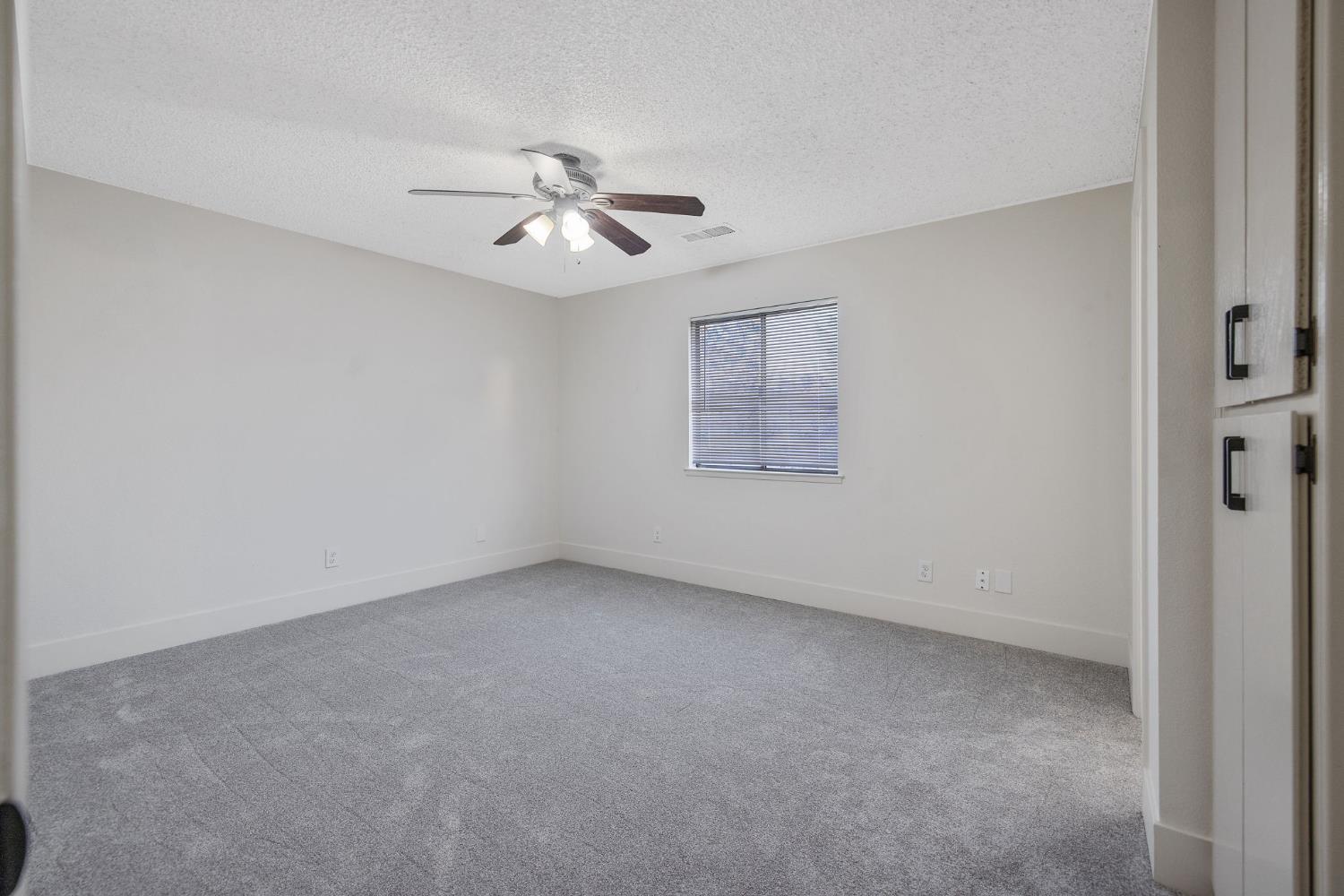 1249 Levich Street Hanford, CA 93230 - Photo 30 of 43 a view of an empty room with a window
