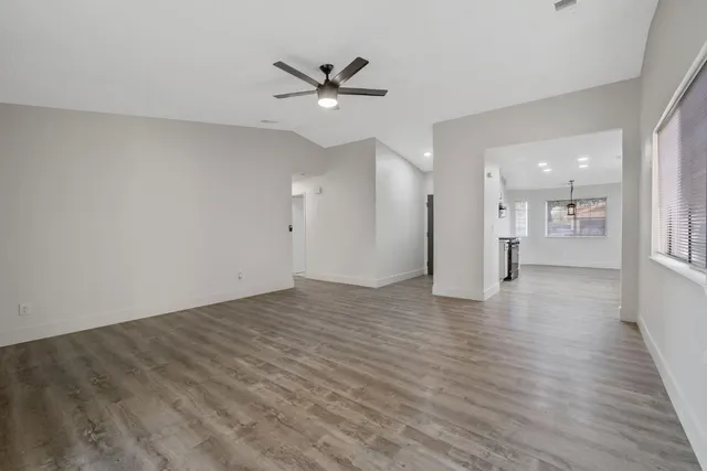 a view of a kitchen with a sink and a refrigerator