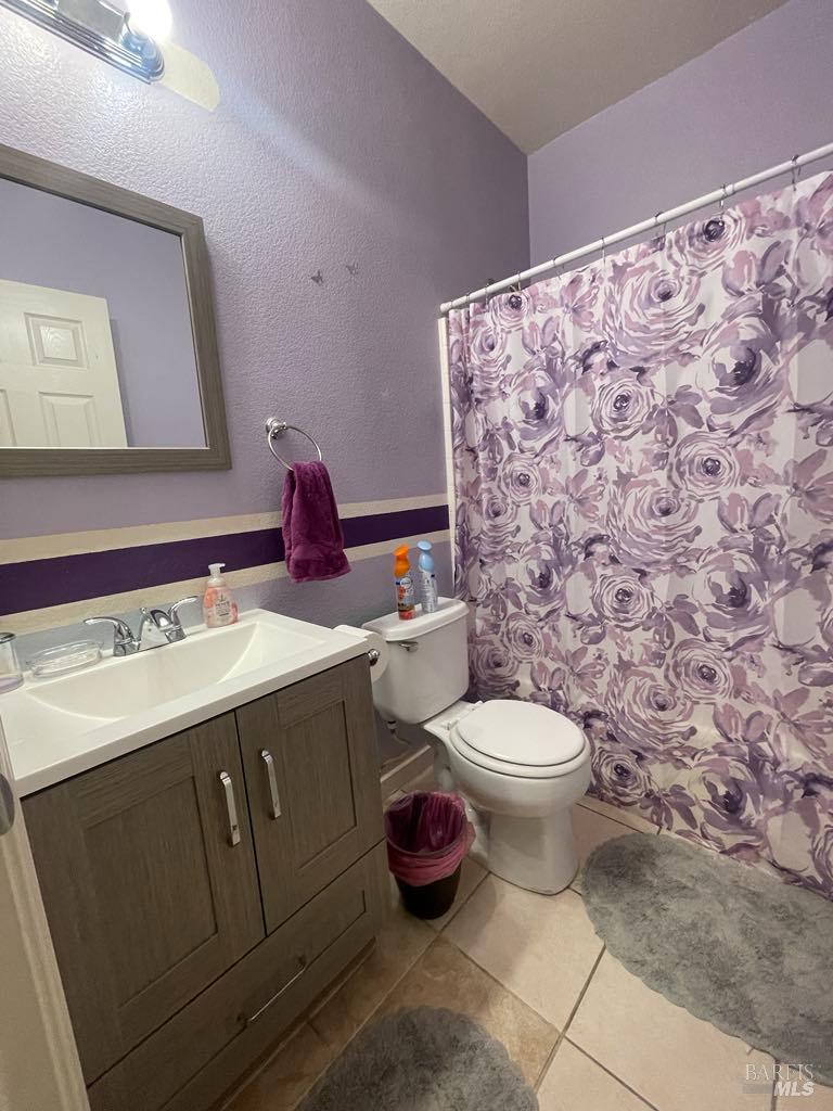 2507 Winterhaven Avenue Santa Rosa, CA 95404 - Photo 16 of 27 a bathroom with a sink toilet and mirror