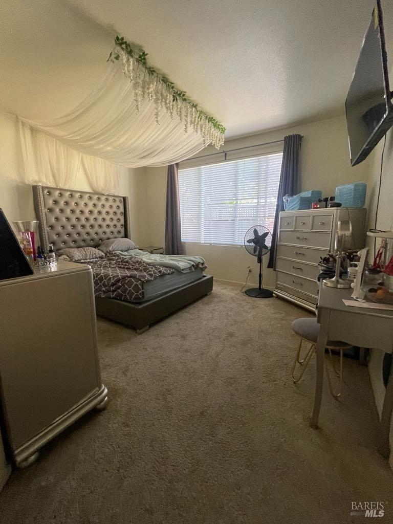 2507 Winterhaven Avenue Santa Rosa, CA 95404 - Photo 17 of 27 a bedroom with furniture and a window