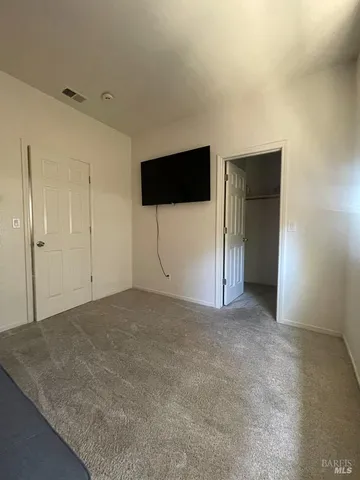 a room with a wooden floor and furniture