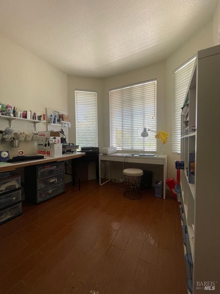 2507 Winterhaven Avenue Santa Rosa, CA 95404 - Photo 21 of 27 a room with a wooden floor and furniture