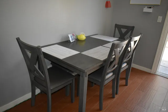 a view of a dining table and chairs in a room