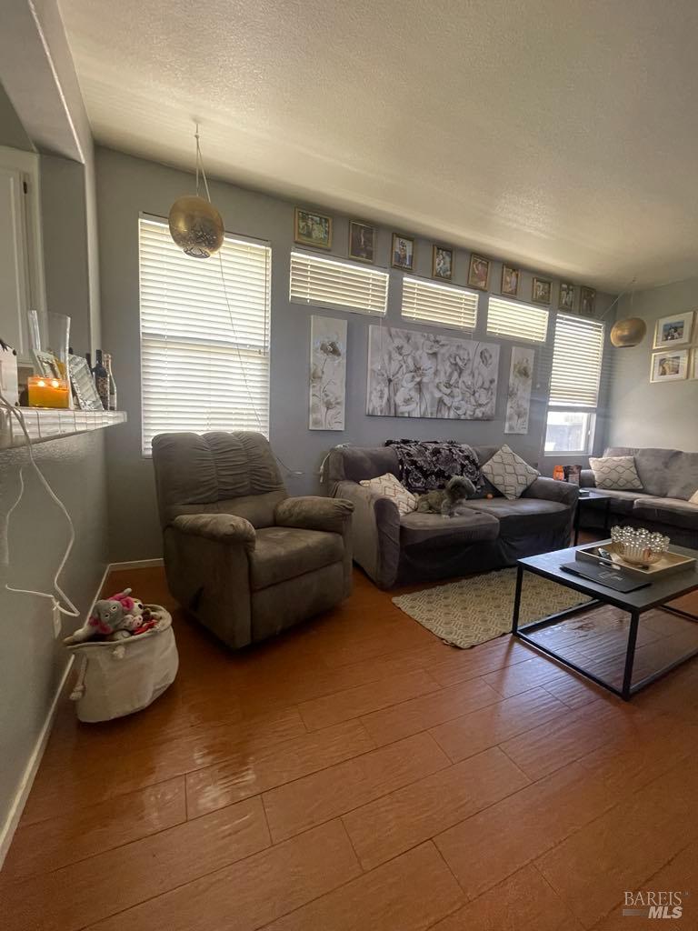 2507 Winterhaven Avenue Santa Rosa, CA 95404 - Photo 8 of 27 a living room with furniture window and a wooden floor