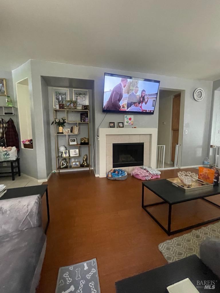 2507 Winterhaven Avenue Santa Rosa, CA 95404 - Photo 10 of 27 a living room with furniture a flat screen tv and a fireplace