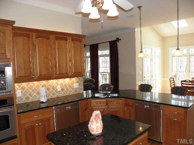7009 Millstone Ridge Court Raleigh, NC 27614 - Photo 7 of 25 The double dishwashers in this gourmet kitchen is just one more way this home for sale is set above and apart from the crowd. Kitchen