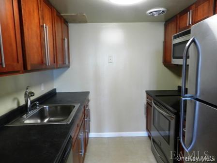 304 Chateau Rive, Unit 304 Peekskill, NY 10566 - Photo 3 of 15 Kitchen featuring appliances with stainless steel finishes and sink