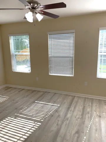 a view of an empty room with a window