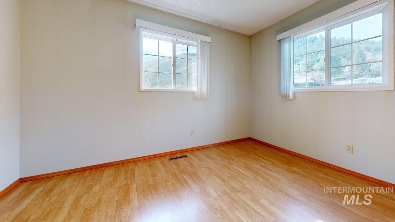 196 Main Street Juliaetta, ID 83535 - Photo 13 of 27 Spare room with light wood-style floors and baseboards