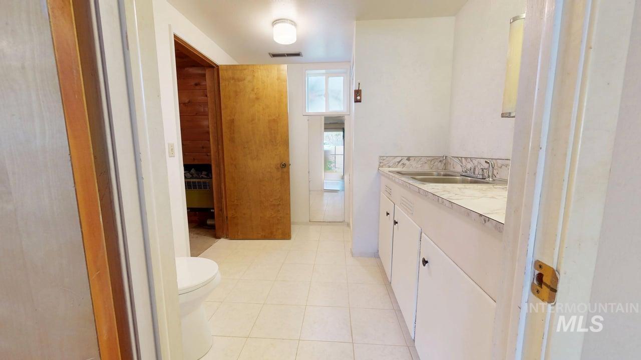 196 Main Street Juliaetta, ID 83535 - Photo 18 of 27 Bathroom featuring vanity and light tile patterned floors