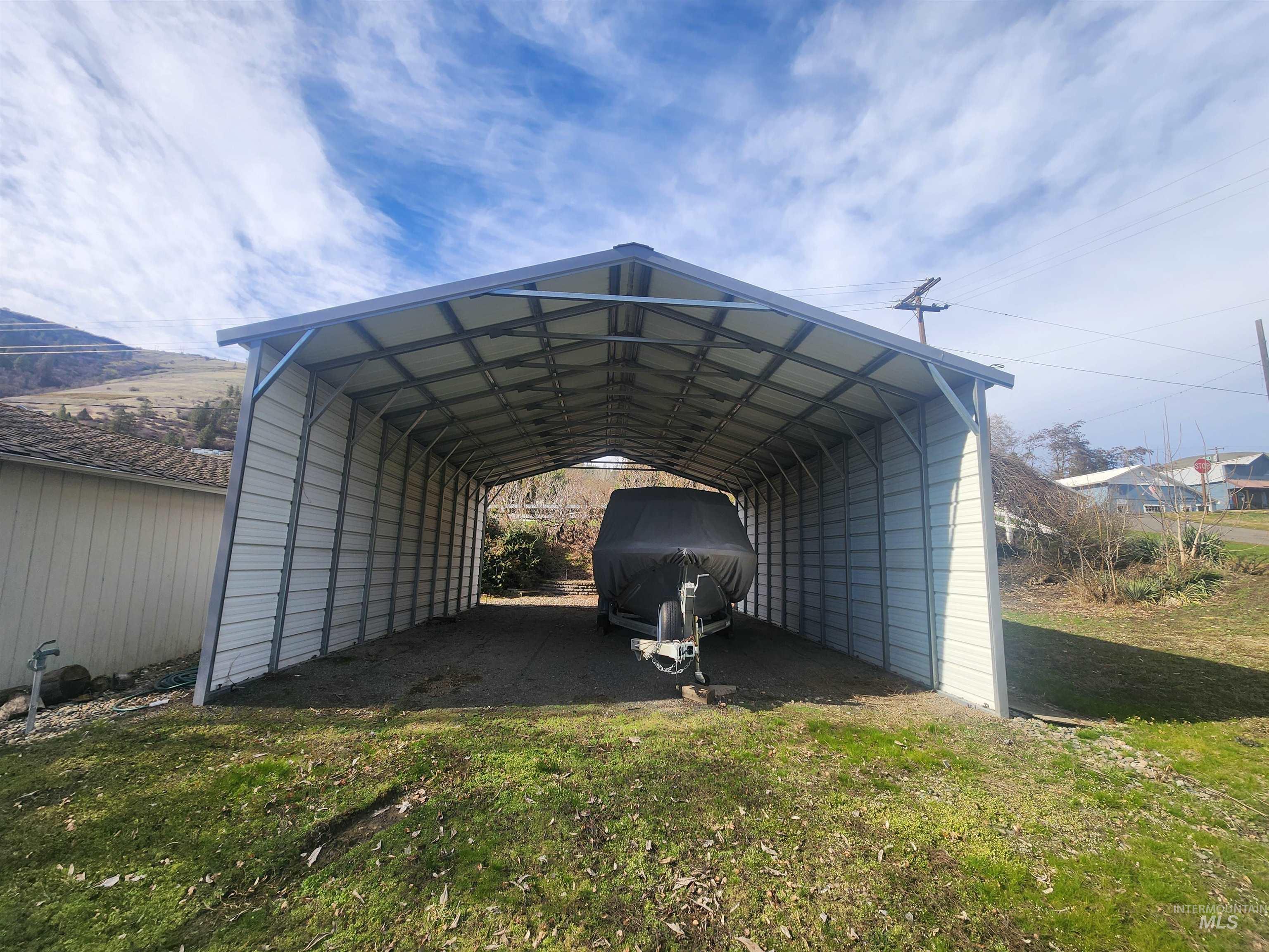 196 Main Street Juliaetta, ID 83535 - Photo 26 of 27 View of parking with a carport