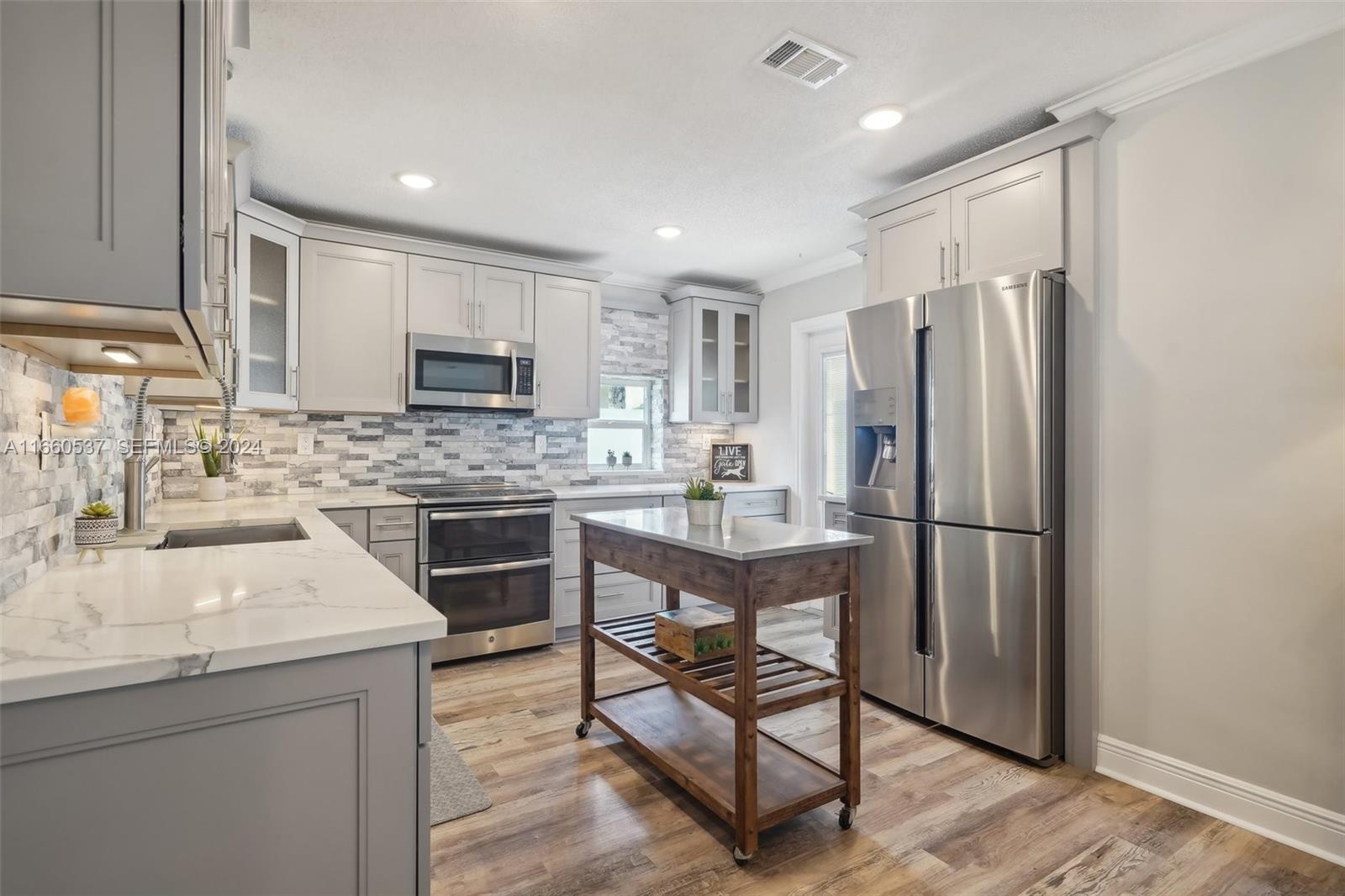 1164 Southwest 14th Street Boca Raton, FL 33486 - Photo 18 of 54 Quartz countertops in the kitchen