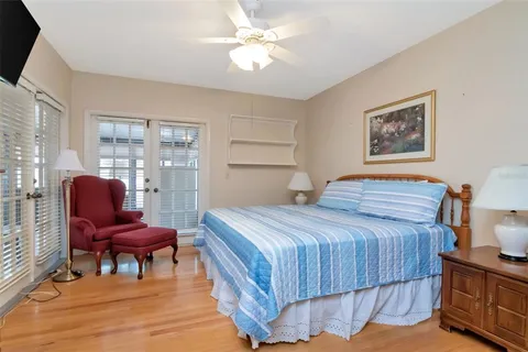 a bedroom with a bed and chair