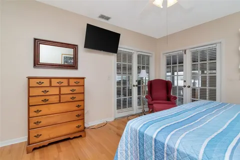 a bed room with a bed and a television