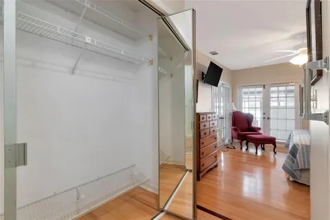 a living room with furniture a wooden floor and a window
