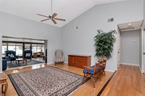 a living room with furniture rug and window