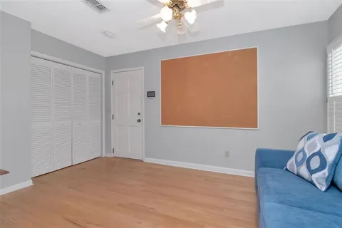 a view of livingroom with hardwood floor and hallway