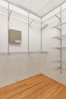a view of a room with wooden floor