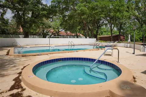 a view of a swimming pool with a patio
