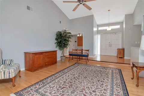 a living room with furniture and a rug