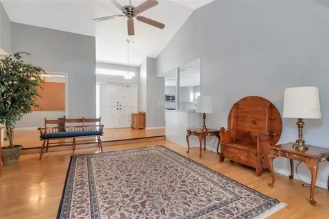 a living room with furniture and a rug