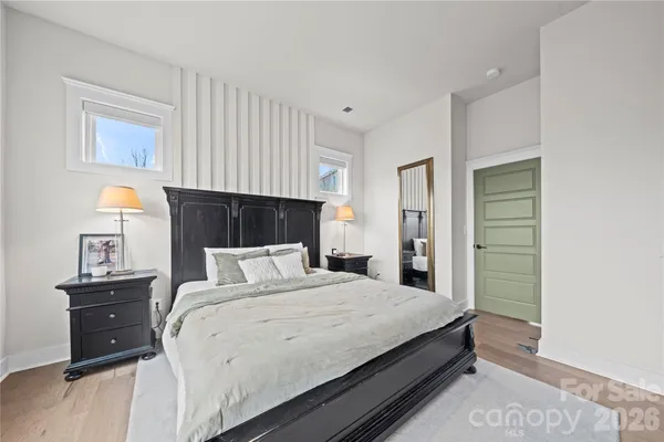a bedroom with a bed and a closet