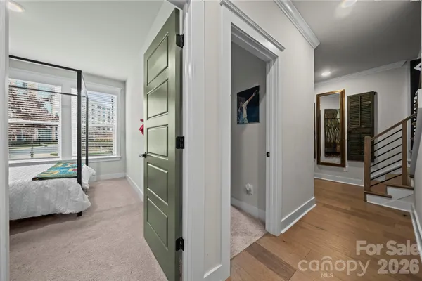 a view of hallway with stairs and furniture