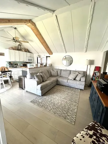 a living room with a couch and a table