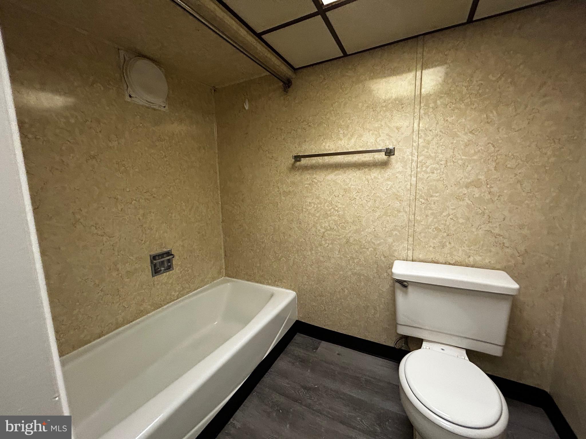 762 East High Street, Unit 3 Pottstown, PA 19464 - Photo 12 of 19 a white toilet sitting next to a bath tub