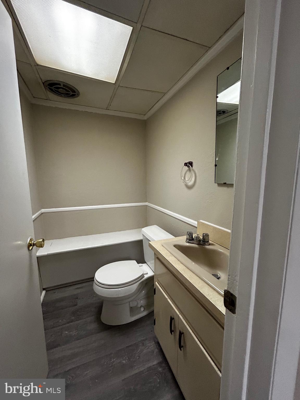 762 East High Street, Unit 3 Pottstown, PA 19464 - Photo 8 of 19 a bathroom with a granite countertop toilet a sink and a mirror