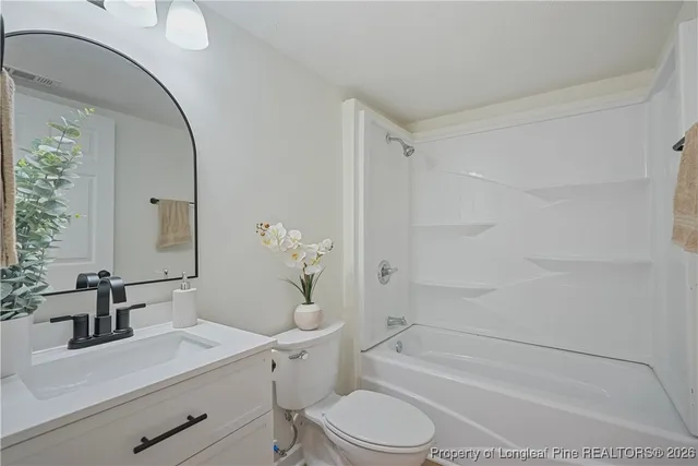 a bathroom with a bath tub with a shower