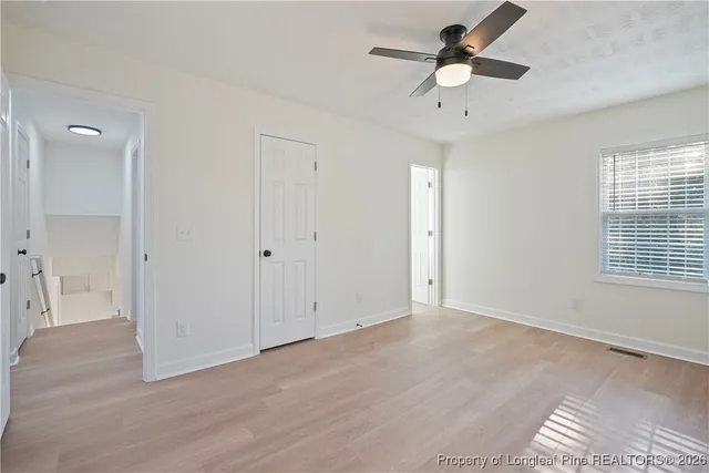 a view of a small space with wooden floor