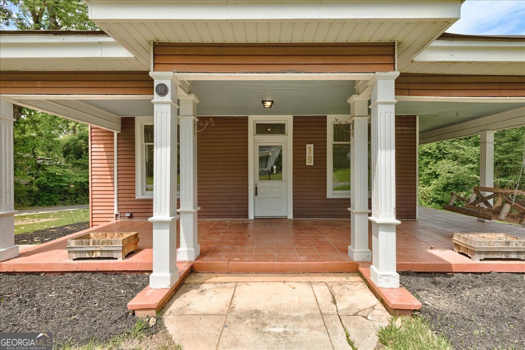 19 McDonough Street Hampton, GA 30228 - Photo 1 of 18 a view of a entryway door front of house
