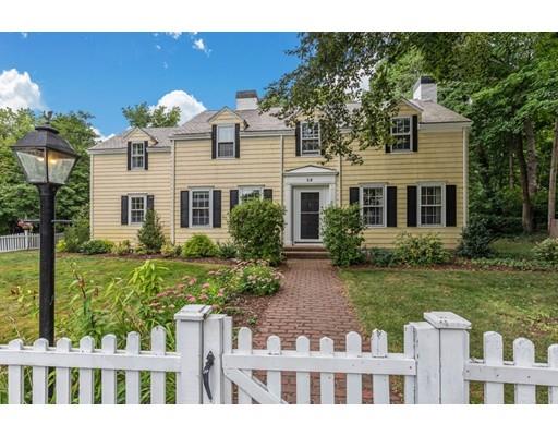a front view of house with a garden