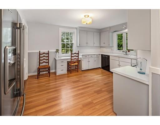 54 Sturtevant Road Quincy, MA 02169 - Photo 14 of 32 a kitchen with stainless steel appliances a refrigerator sink and cabinets