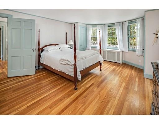 54 Sturtevant Road Quincy, MA 02169 - Photo 18 of 32 a bedroom with a bed and wooden floor