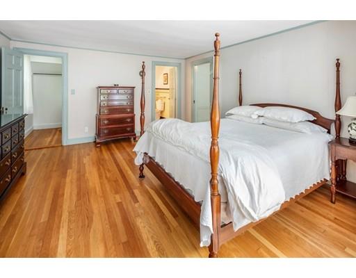 54 Sturtevant Road Quincy, MA 02169 - Photo 19 of 32 a spacious bedroom with a bed and a walk in closet