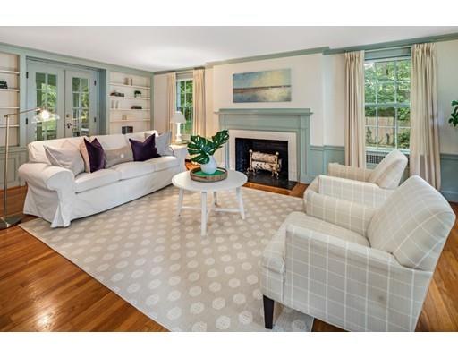 54 Sturtevant Road Quincy, MA 02169 - Photo 2 of 32 a living room with furniture a large window and a fireplace