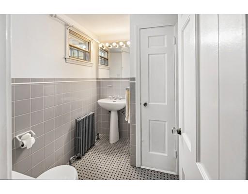 54 Sturtevant Road Quincy, MA 02169 - Photo 26 of 32 a bathroom with a sink a toilet and shower