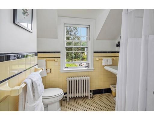 54 Sturtevant Road Quincy, MA 02169 - Photo 27 of 32 a bathroom with a sink a toilet a window and a mirror