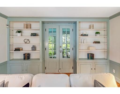54 Sturtevant Road Quincy, MA 02169 - Photo 4 of 32 a living room with furniture and a book shelf